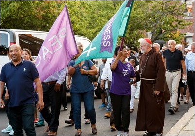 Cardinal O’Malley, priests and other religious leaders participate in a walk for peace in Dorchester, July 11, 2017. Pilot photo/ Mark Labbe 