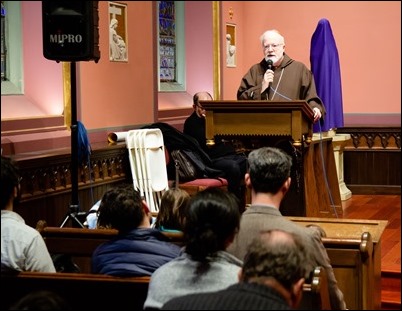 Cardinal O’Malley greets members of Communion and Liberation who concluded their Good Friday Stations of the Cross at the Cathedral, March 30, 2018. Pilot photo/ Mark Labbe 