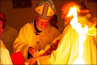 Cardinal O’Malley celebrates the Easter Vigil with the blessing of the Easter fire and the reception of new members of the Church at the Cathedral of the Holy Cross, March 31, 2018. Pilot photo/ Mark Labbe 