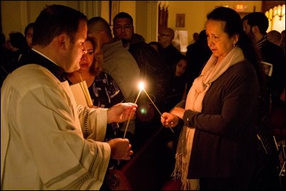 Cardinal O’Malley celebrates the Easter Vigil with the blessing of the Easter fire and the reception of new members of the Church at the Cathedral of the Holy Cross, March 31, 2018. Pilot photo/ Mark Labbe 