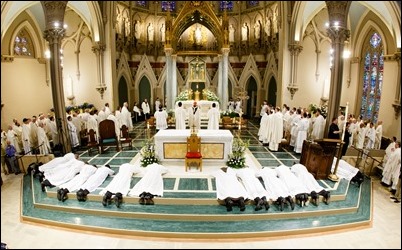 Ordination of Transitional Deacons Joseph Almeida, Maciej Kazimierz Araszkiewicz, Corey Bassett-Tirrell, Marcos Enrique, Timothy Paul Hynes, Przemyslaw Kasprzak, Brother John Edward Koelle OFM Cap., Brian Peter O’Hanlon, Mark Teodor Olejnik, Francis Huy Duc Pham, William Henry Robinson, Carignan Langlois Rouse, Victor Luna Vitug II, and James Paul Wargovich at Immaculate Conception Church in Lowell, April 14, 2018. Pilot photo/ Gregory L. Tracy 