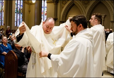 Ordination of Transitional Deacons Joseph Almeida, Maciej Kazimierz Araszkiewicz, Corey Bassett-Tirrell, Marcos Enrique, Timothy Paul Hynes, Przemyslaw Kasprzak, Brother John Edward Koelle OFM Cap., Brian Peter O’Hanlon, Mark Teodor Olejnik, Francis Huy Duc Pham, William Henry Robinson, Carignan Langlois Rouse, Victor Luna Vitug II, and James Paul Wargovich at Immaculate Conception Church in Lowell, April 14, 2018. Pilot photo/ Gregory L. Tracy 