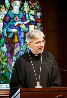 Father Demetri Tonias, representative of the Greek Orthodox Metropolitan of Boston, attends the Mass celebrated by Father Daniel Hennessey on the Feast of the Sts. Peter and Paul at the Archdiocese of Boston’s Pastoral Center in Braintree, June 29, 2018. For almost 30 years the Catholic and Greek Orthodox communities of Boston have followed the practice of exchanging delegations on the feast days of their patron saints. Pilot photo/ Gregory L. Tracy