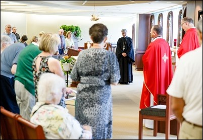 Father Demetri Tonias, representative of the Greek Orthodox Metropolitan of Boston, attends the Mass celebrated by Father Daniel Hennessey on the Feast of the Sts. Peter and Paul at the Archdiocese of Boston’s Pastoral Center in Braintree, June 29, 2018. For almost 30 years the Catholic and Greek Orthodox communities of Boston have followed the practice of exchanging delegations on the feast days of their patron saints. Pilot photo/ Gregory L. Tracy