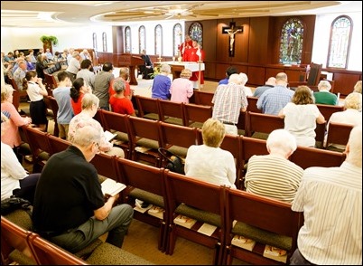 Father Demetri Tonias, representative of the Greek Orthodox Metropolitan of Boston, attends the Mass celebrated by Father Daniel Hennessey on the Feast of the Sts. Peter and Paul at the Archdiocese of Boston’s Pastoral Center in Braintree, June 29, 2018. For almost 30 years the Catholic and Greek Orthodox communities of Boston have followed the practice of exchanging delegations on the feast days of their patron saints. Pilot photo/ Gregory L. Tracy