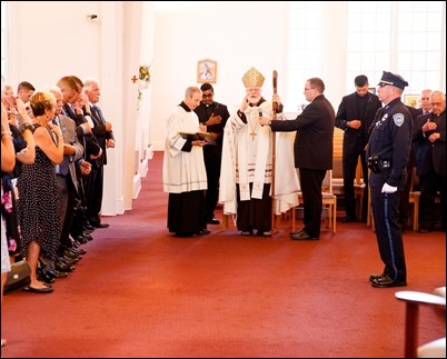 Cardinal Sean P. O’Malley celebrates the Rite of Reception for fallen Weymouth Police officer Sgt. Michael Chesna at St. Mary Church in Hanover, July 19, 2018. Photo by Gregory L. Tracy, The Pilot