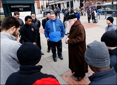 Cardinal O’Malley gives his blessing to seminarians from St. John Seminary as they prepare to distribute food and Miraculous Medals to the homeless and needy on BostonCommon as part of the Fratello initiative, marking World Day of the Poor, Nov. 18, 2018. Pilot photo/ Gregory L. Tracy 