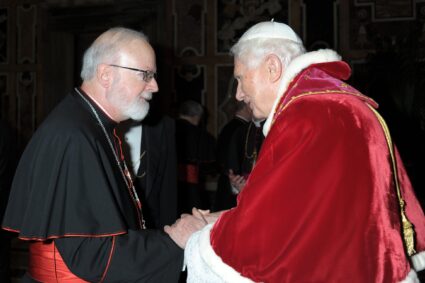 Cardinal Sean P. O'Malley of Boston exchanges greetings with Pope Benedict XVI as the pope meets for the last time with the College of Cardinals at the Vatican Feb. 28, 2013. 